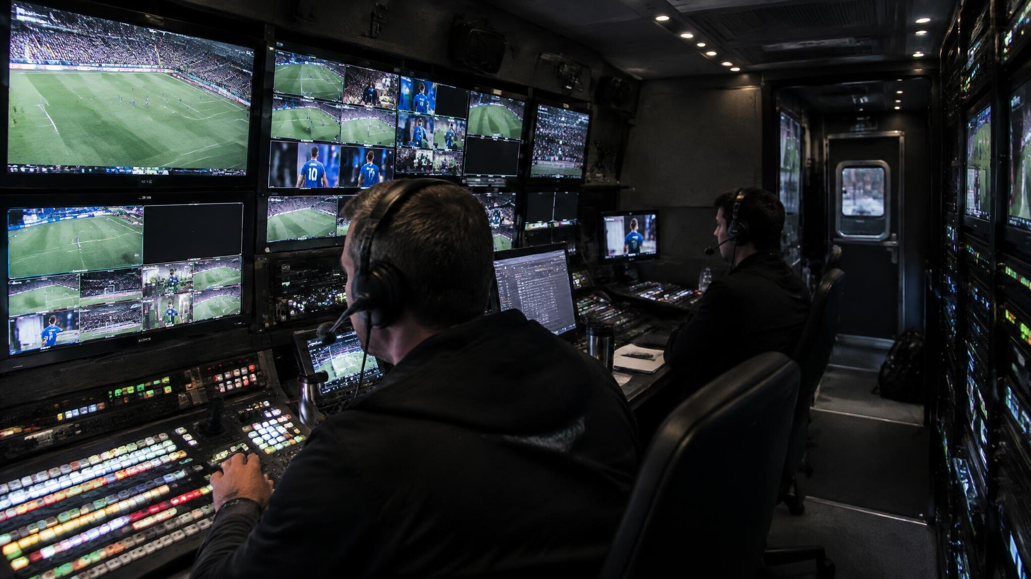 Interior of an outside broadcast van with monitor banks